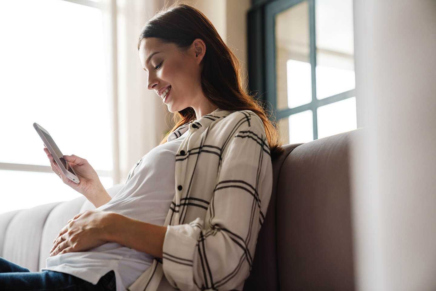 pregnant woman with the phone